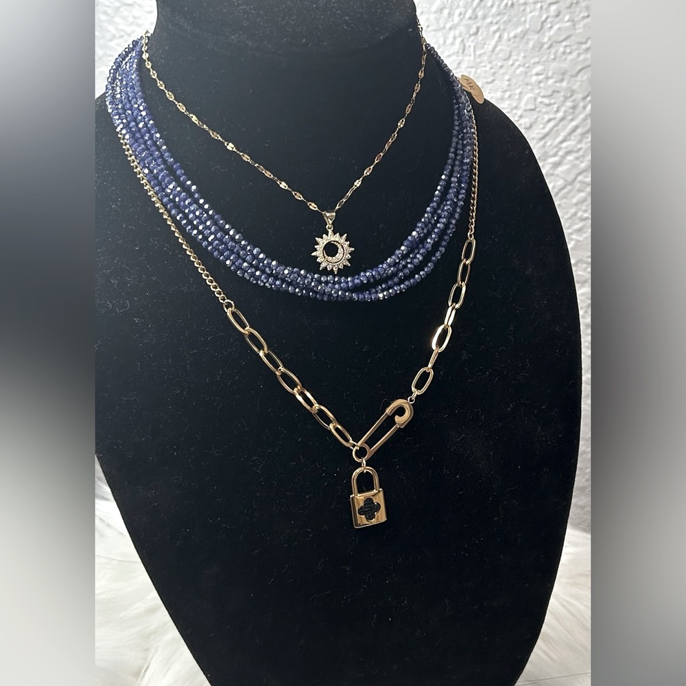 Both gold are ( stainless steel) and the blue is bijou. Each one have price